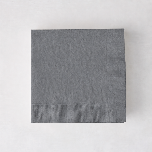 Square grey 3-ply paper cocktail napkin with a textured border on a white background.