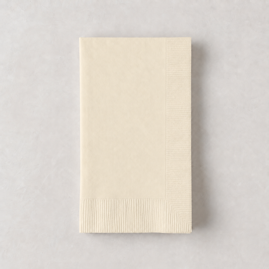 Folded ivory 3-ply paper hand towel with a textured border on a light gray surface.