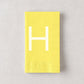 Pale yellow 3-ply paper hand towel with a white letter H monogram, 8 by 4.5 inches.