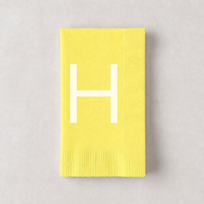 Pale yellow 3-ply paper hand towel with a white letter H monogram, 8 by 4.5 inches.