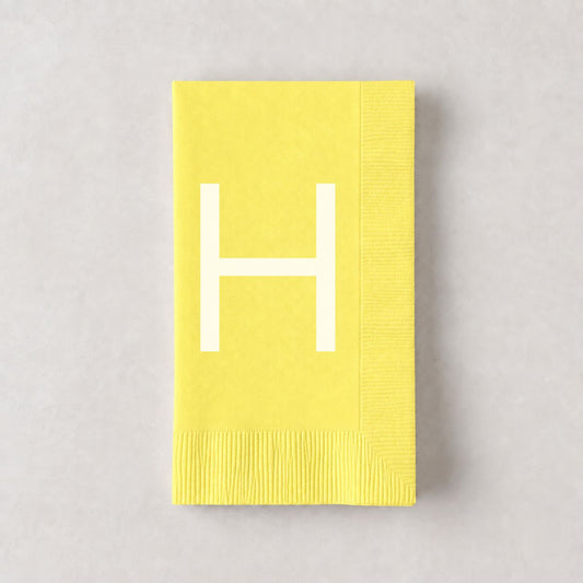 Pale yellow 3-ply paper hand towel with a white letter H monogram, 8 by 4.5 inches.