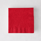 Square red 3-ply paper cocktail napkin with a textured border on a light background.