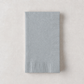 Folded silver 3-ply paper hand towel with a textured border on a neutral background.