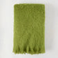 Pesto Green Solid Mohair Throw Blanket, 72"L x 51"W, with fringed edge.