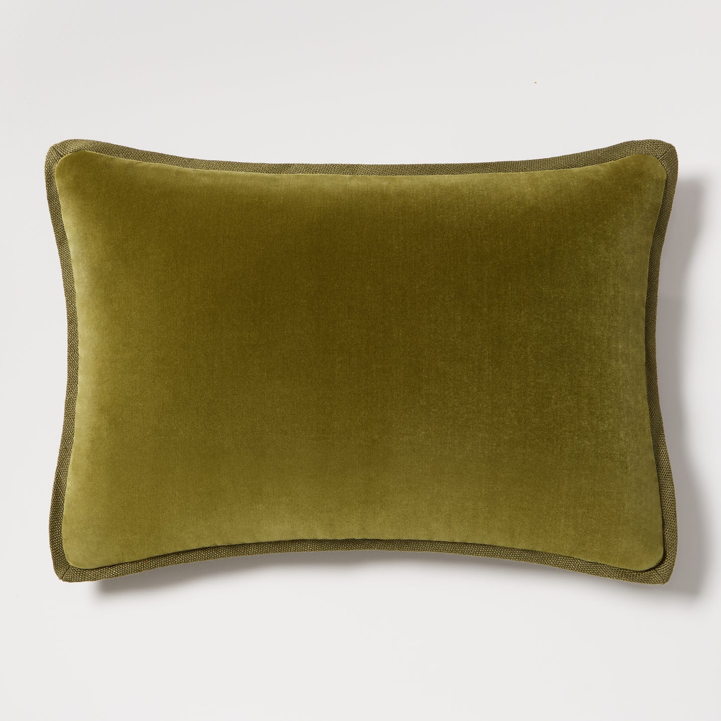 Pesto green tonal reversible velvet and linen lumbar pillow, 20"L x 14"H, with a hidden zipper.