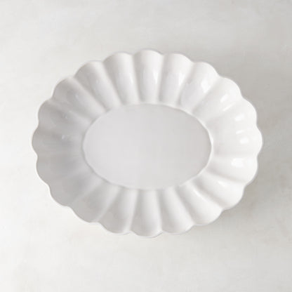 White Petal Large Oval Ceramic Serve Bowl with scalloped edges and glazed finish.