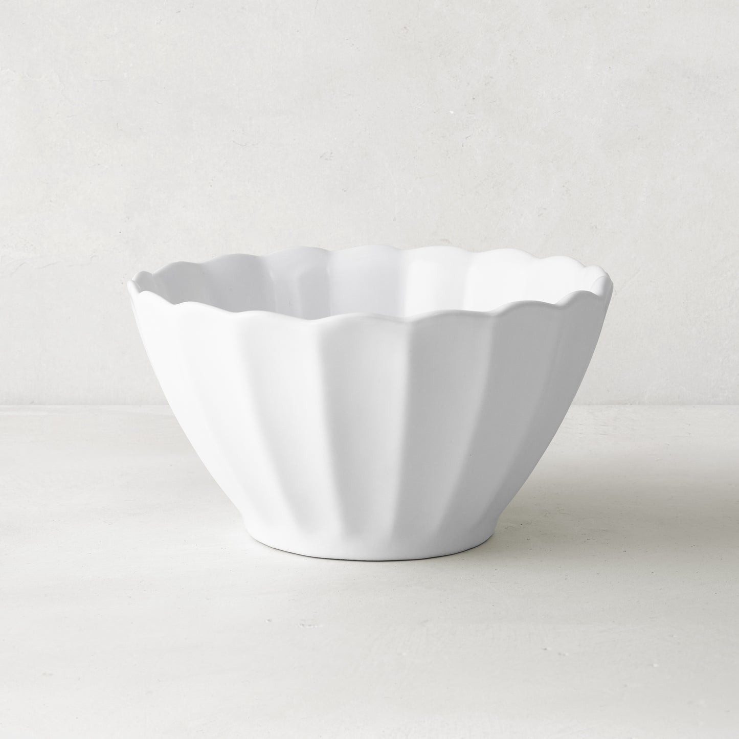 White Petal Stoneware Bowl, 6" diameter, with a fluted, vintage-inspired design and rounded edges.