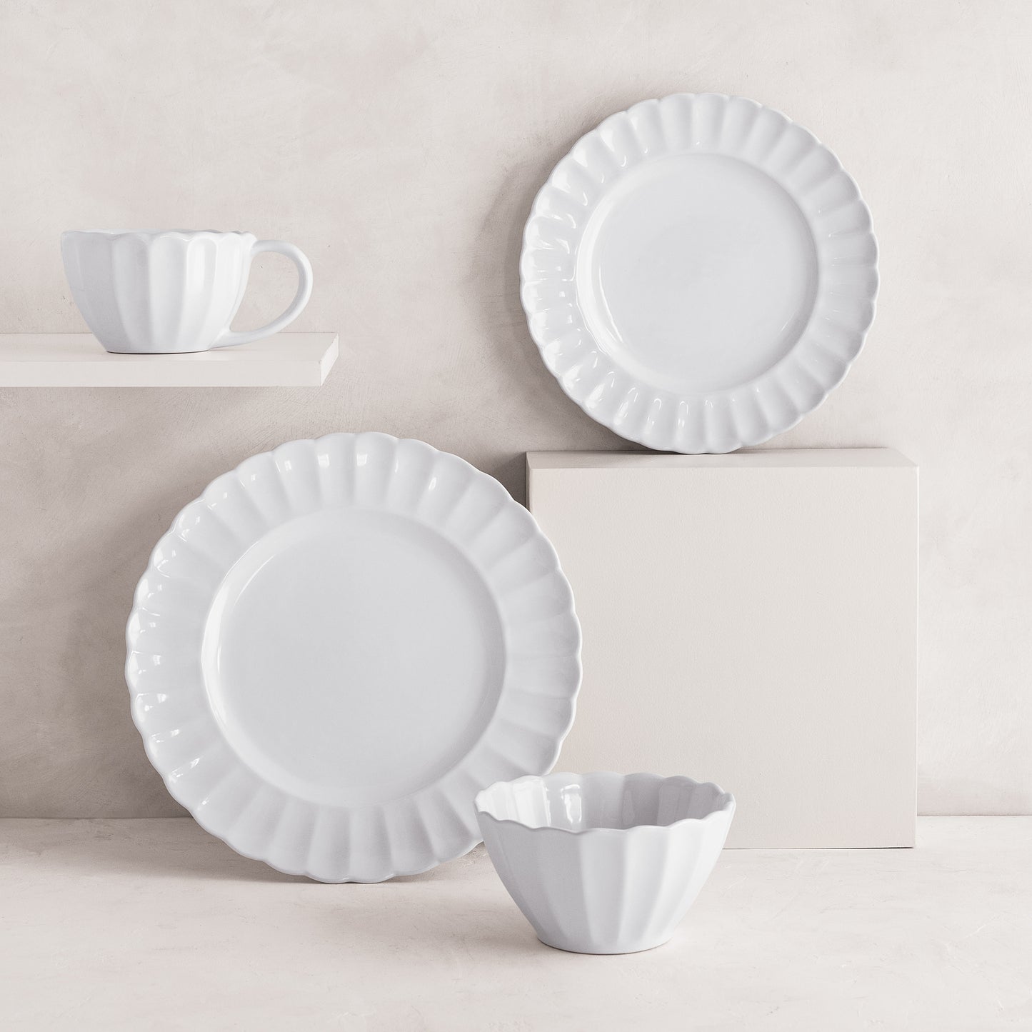 White Petal Stoneware Dinner Plate, salad plate, bowl, and mug with ruffled edges.