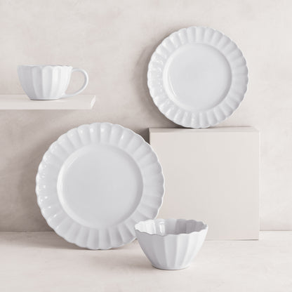 White Petal Stoneware Dinner Plate, salad plate, bowl, and mug with ruffled edges.