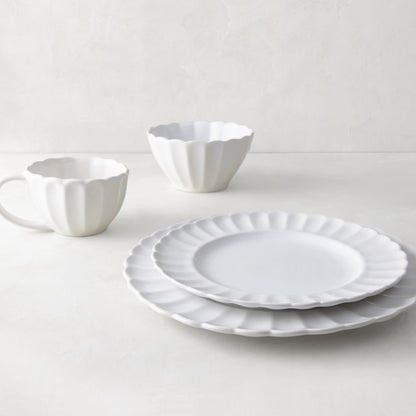 White Petal Stoneware Dinner Plate, salad plate, bowl, and mug with scalloped edges.