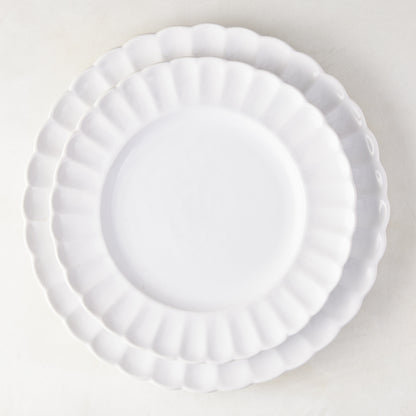 Two white Petal Stoneware Dinner Plates, 11.25" diameter, with scalloped edges, stacked on a white surface.