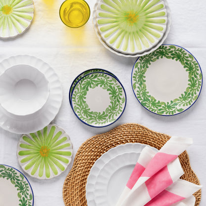 White Petal Stoneware Salad Plate with scalloped edges, part of a dinnerware collection on a white tablecloth.