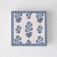 Peter Dunham + Hudson Grace Shani cocktail napkins with blue botanical print and border.