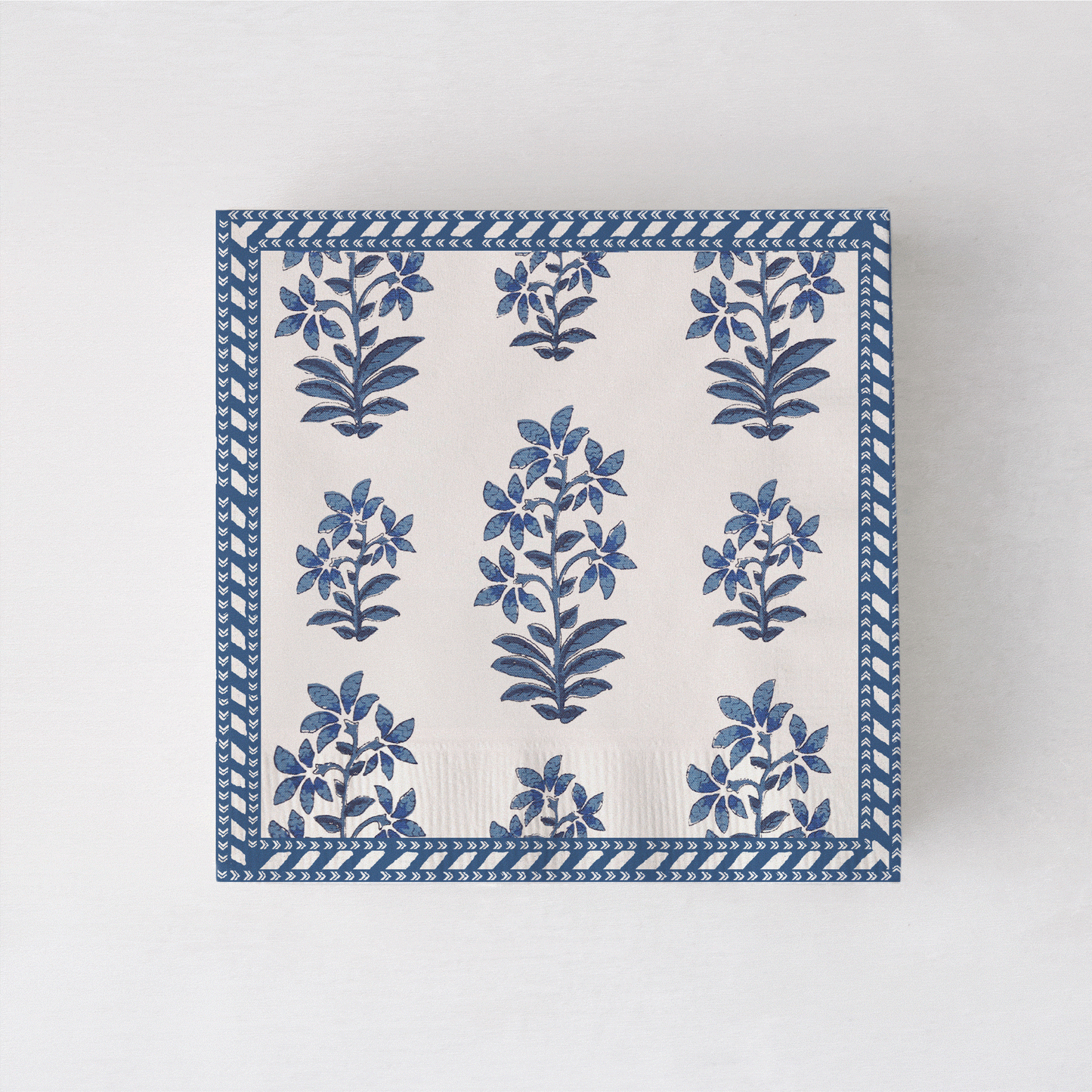 Peter Dunham + Hudson Grace Shani cocktail napkins with blue botanical print and border.