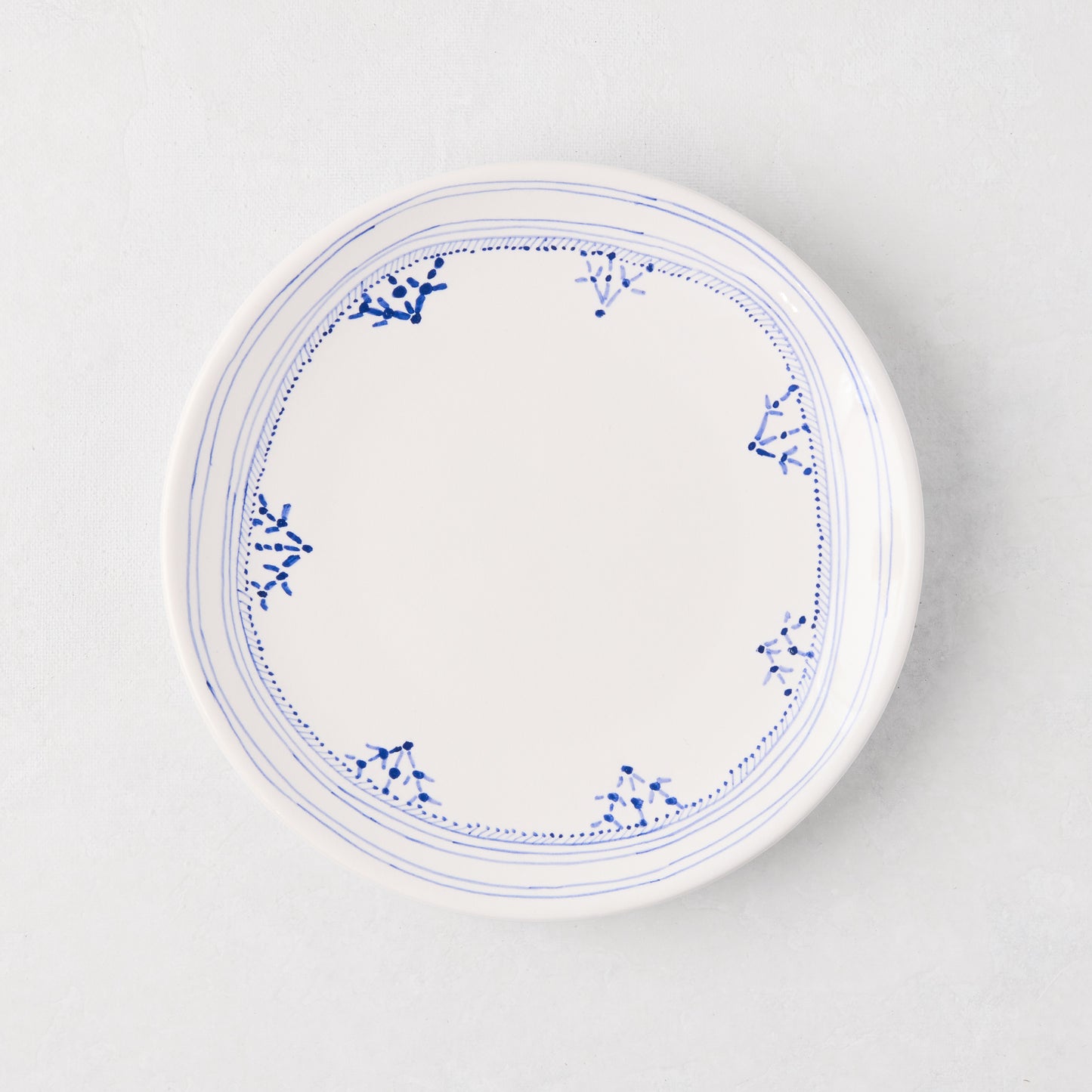 Peter Dunham + Hudson Grace Blue Fez hand-painted appetizer plate with blue border pattern.