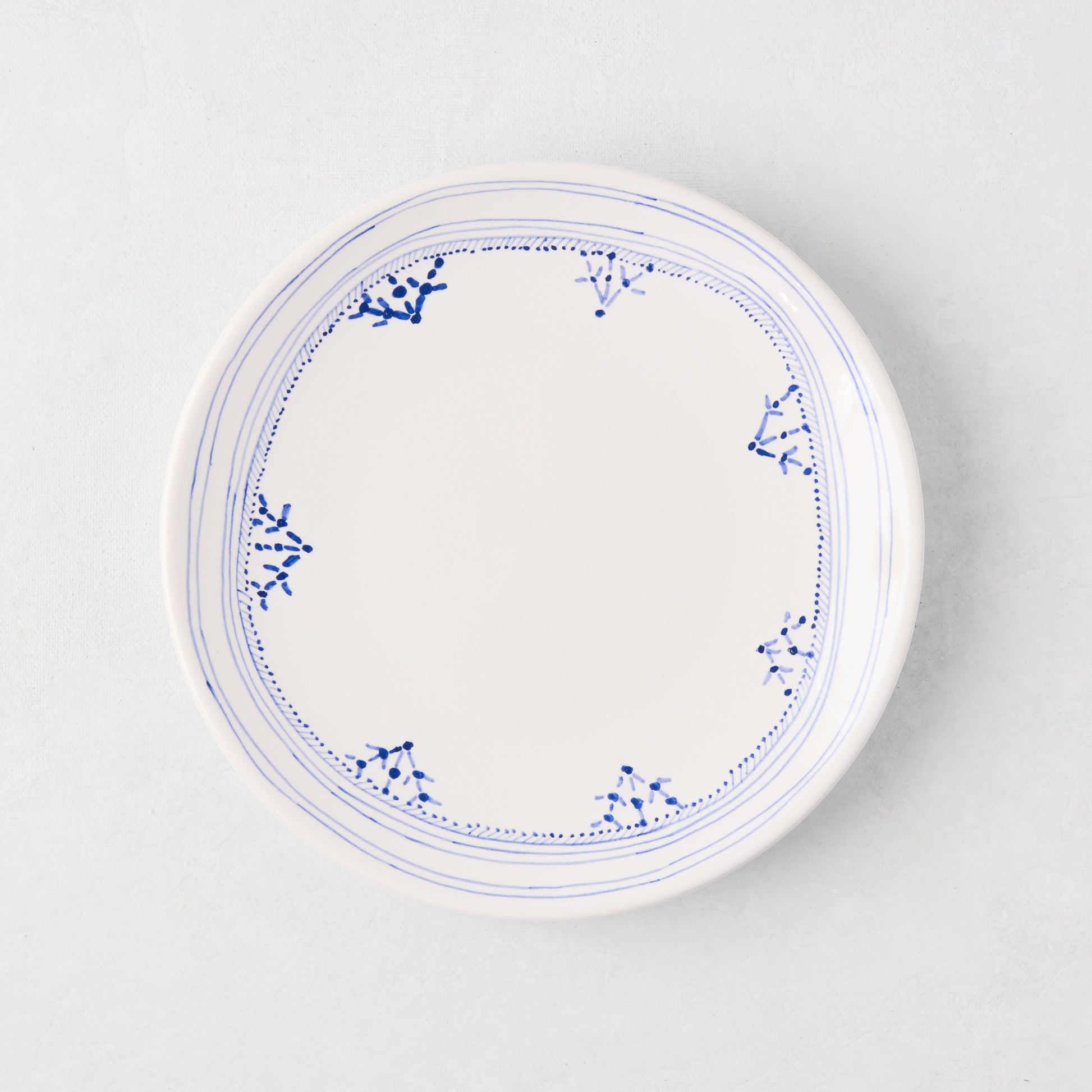 Peter Dunham + Hudson Grace Blue Fez hand-painted appetizer plate with blue border pattern.