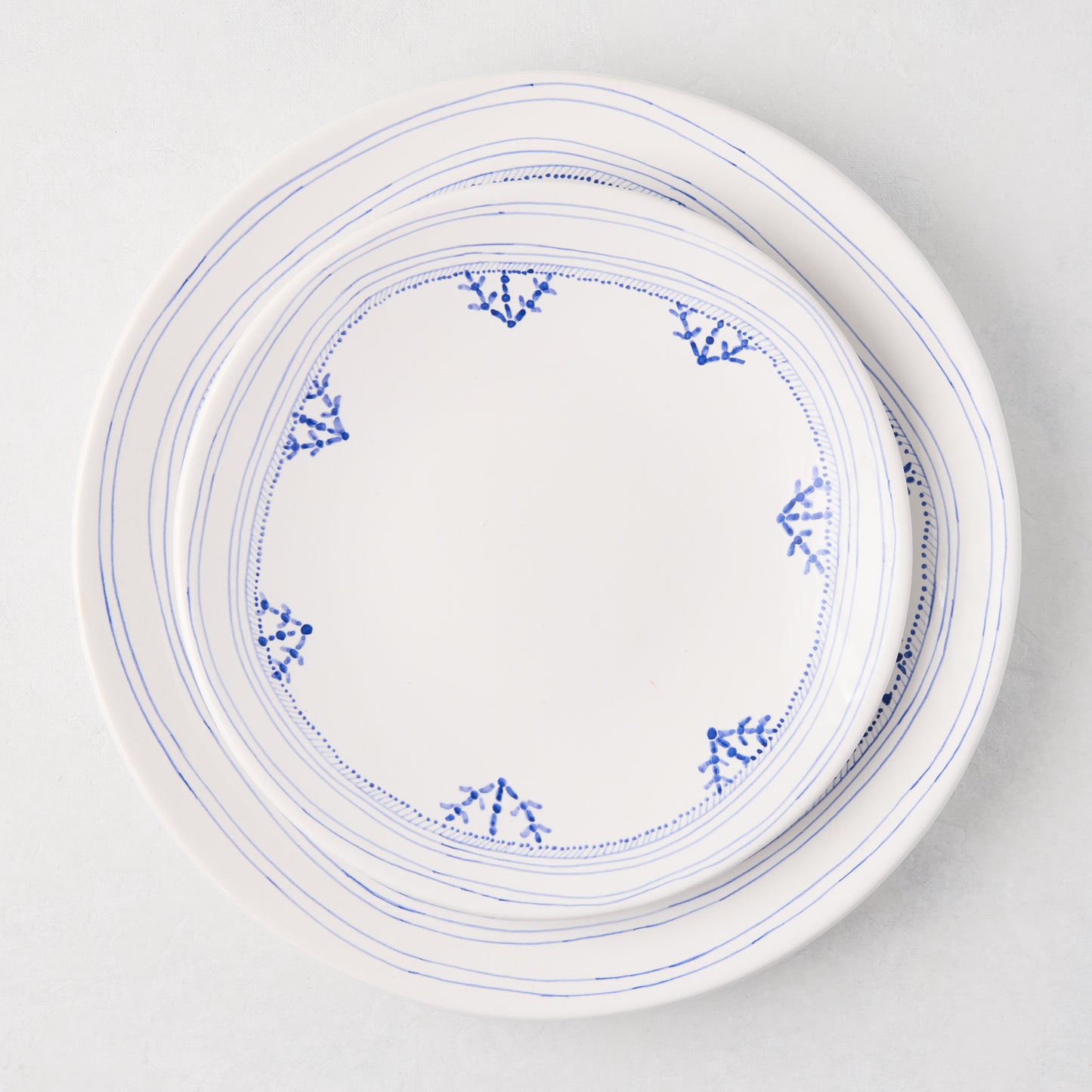 Peter Dunham + Hudson Grace Blue Fez hand-painted ceramic dinner plate with a blue border design.