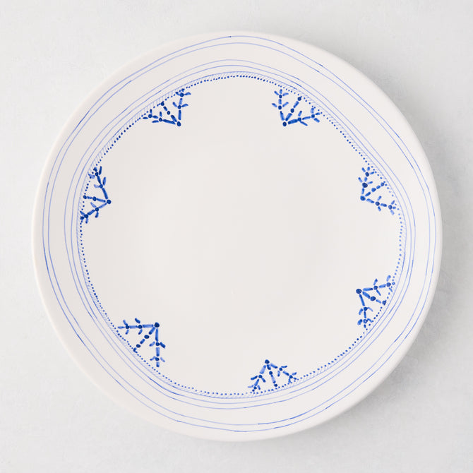 Peter Dunham + Hudson Grace Blue Fez dinner plate, white with hand-painted blue border pattern.