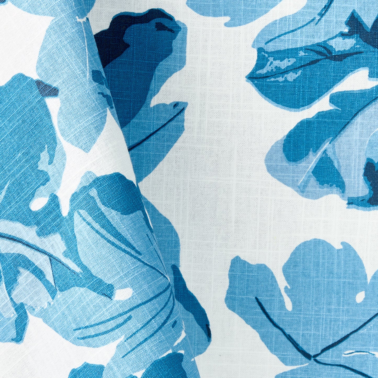 Peter Dunham + Hudson Grace blue fig leaf print on textured white cotton slub tablecloth fabric.