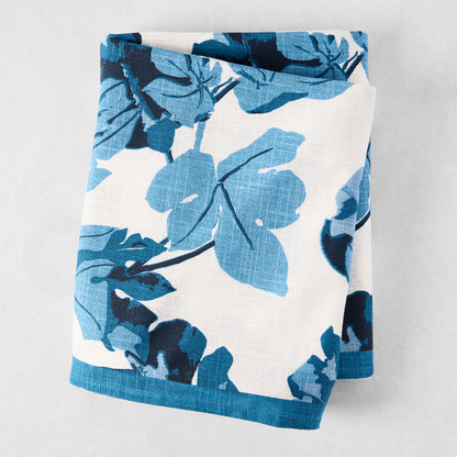Peter Dunham + Hudson Grace Blue Fig Leaf Printed White Tablecloth, 100% cotton slub, folded.