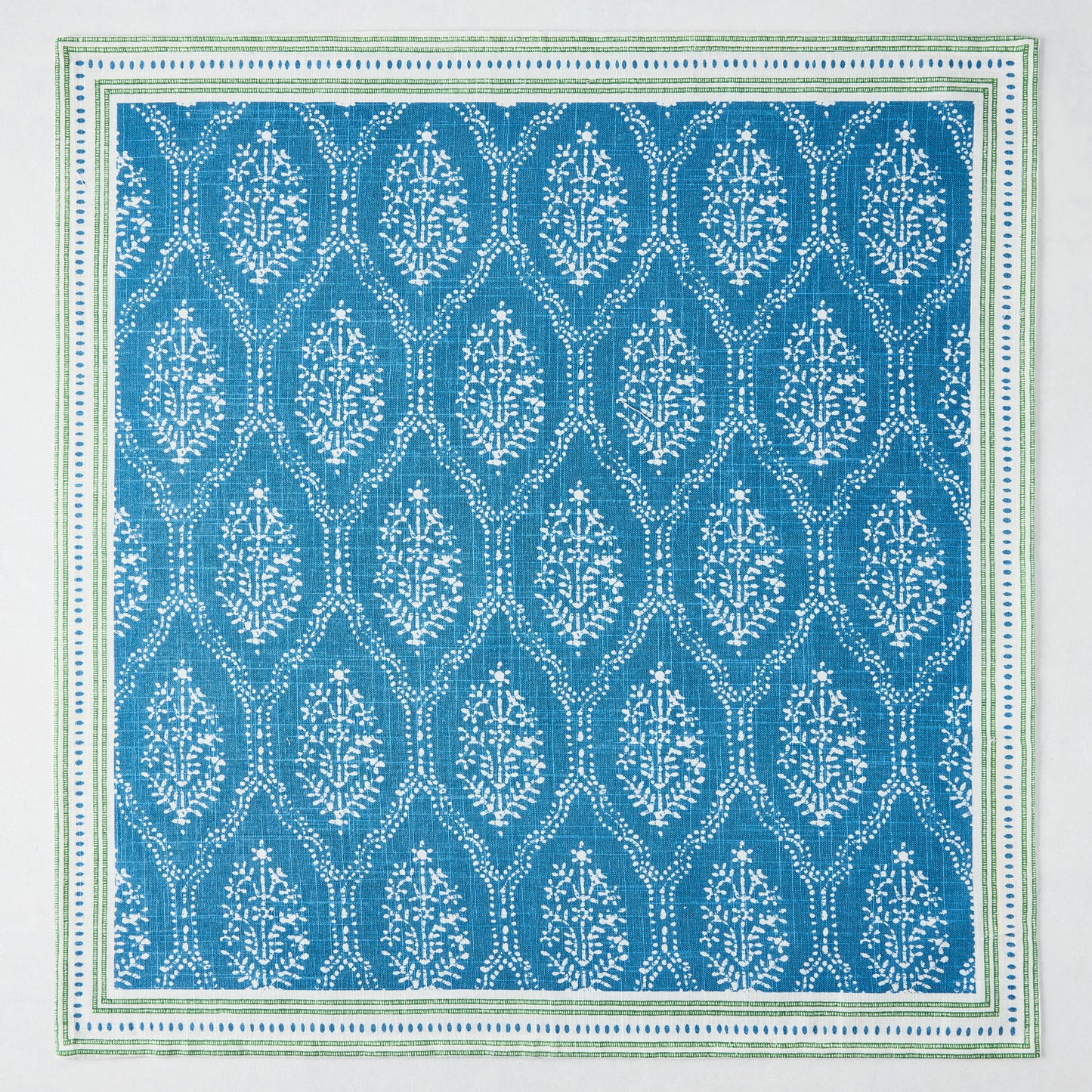 Peter Dunham + Hudson Grace Blue Jaali Printed Napkin, 100% cotton slub with green border.