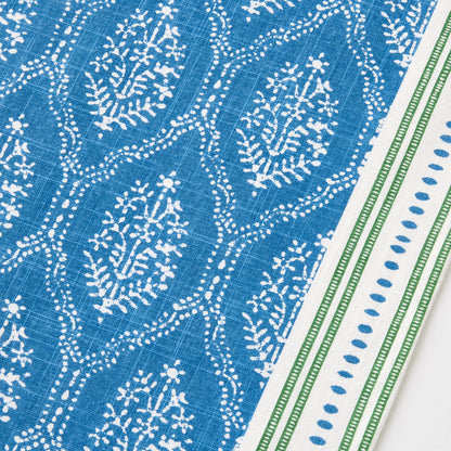 Blue Jaali floral print cotton slub table runner with a green and white striped border.