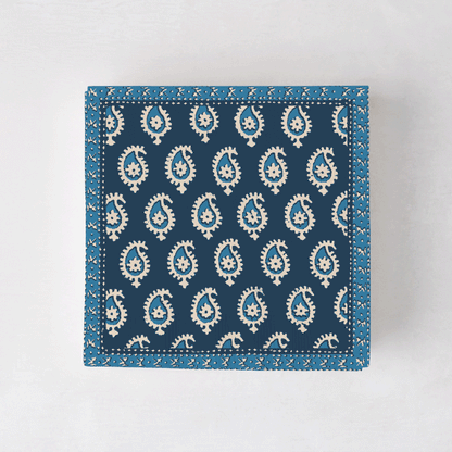 Peter Dunham + Hudson Grace Blue Janpath cocktail napkins with white paisley pattern.