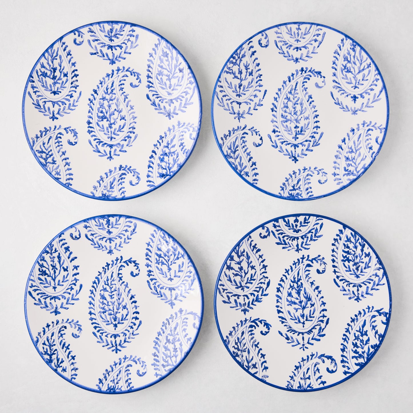 Four Peter Dunham + Hudson Grace Blue Kashmir hand-painted paisley salad plates.
