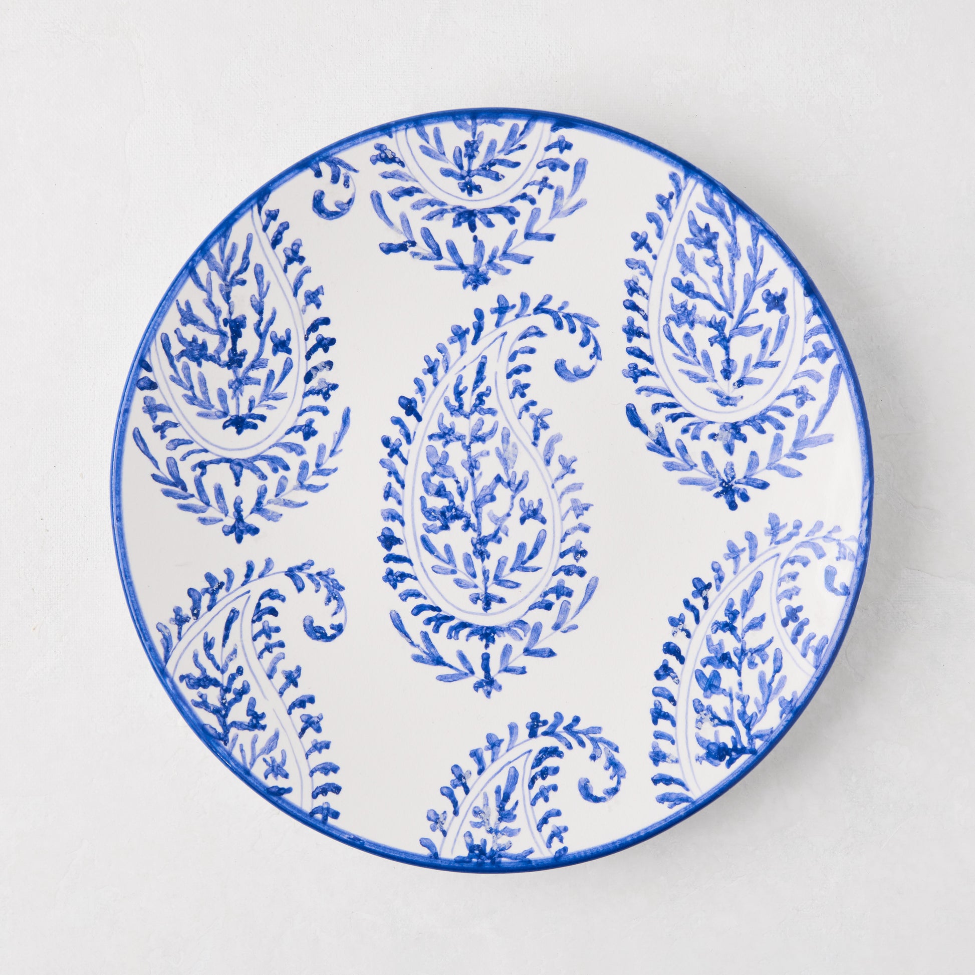 Peter Dunham + Hudson Grace Blue Kashmir hand-painted paisley salad plate, white with blue design.