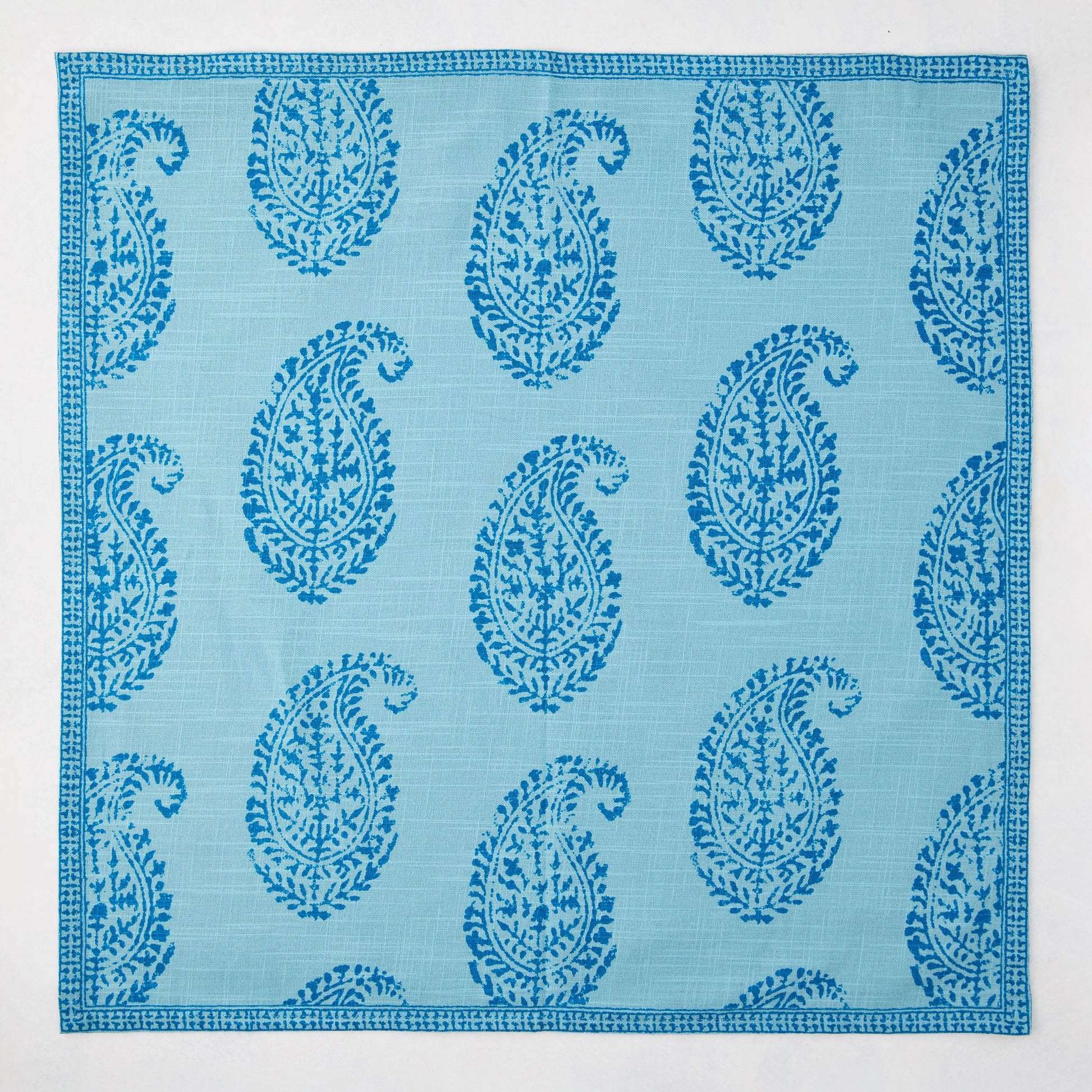 Peter Dunham + Hudson Grace Blue Kashmir Paisley Printed Napkin, light blue with darker blue paisley pattern.