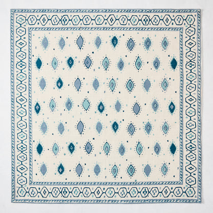 Peter Dunham + Hudson Grace Blue Oona Printed Napkin, ivory cotton slub with tribal blue diamond pattern and border.