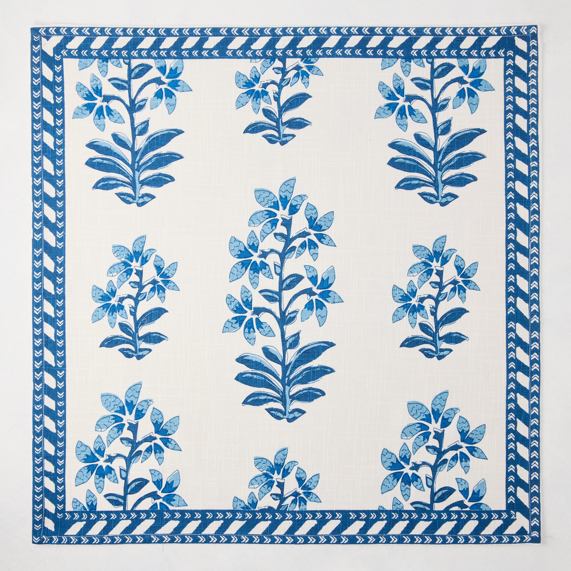 Peter Dunham + Hudson Grace Blue Shani Floral Printed Napkin, 100% cotton slub with botanical pattern and border.