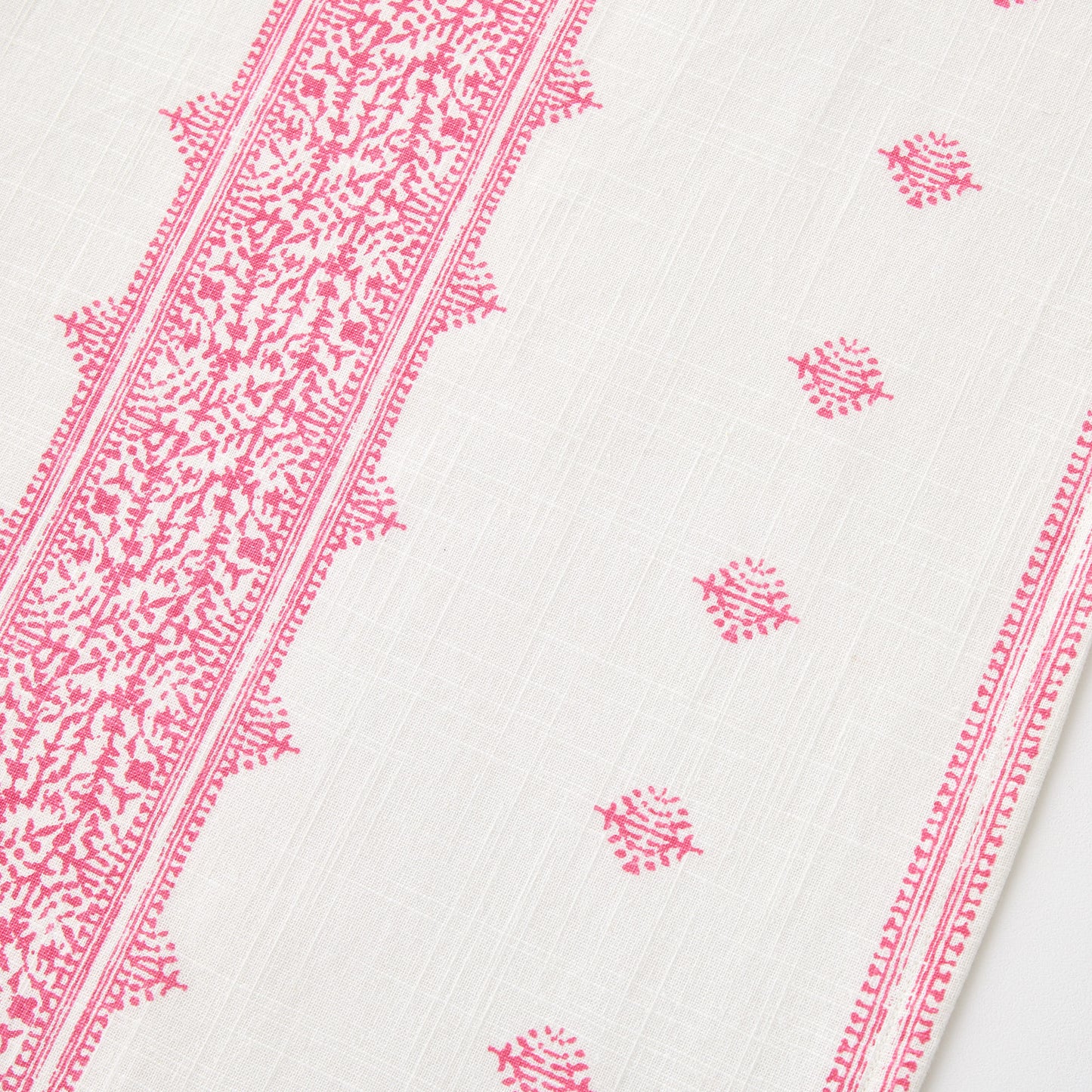 Bright pink Fez print on white 100% cotton slub table runner with intricate embroidery-inspired patterns.