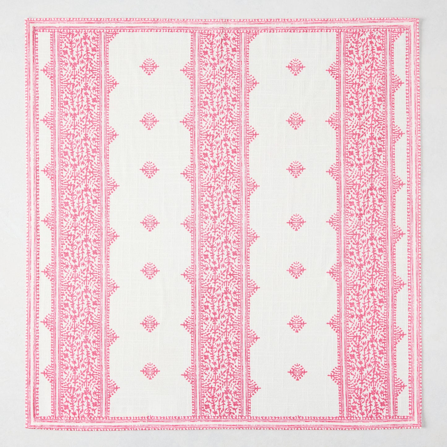 Bright pink Fez Stripe printed cotton slub napkin with intricate vintage embroidery-inspired pattern.