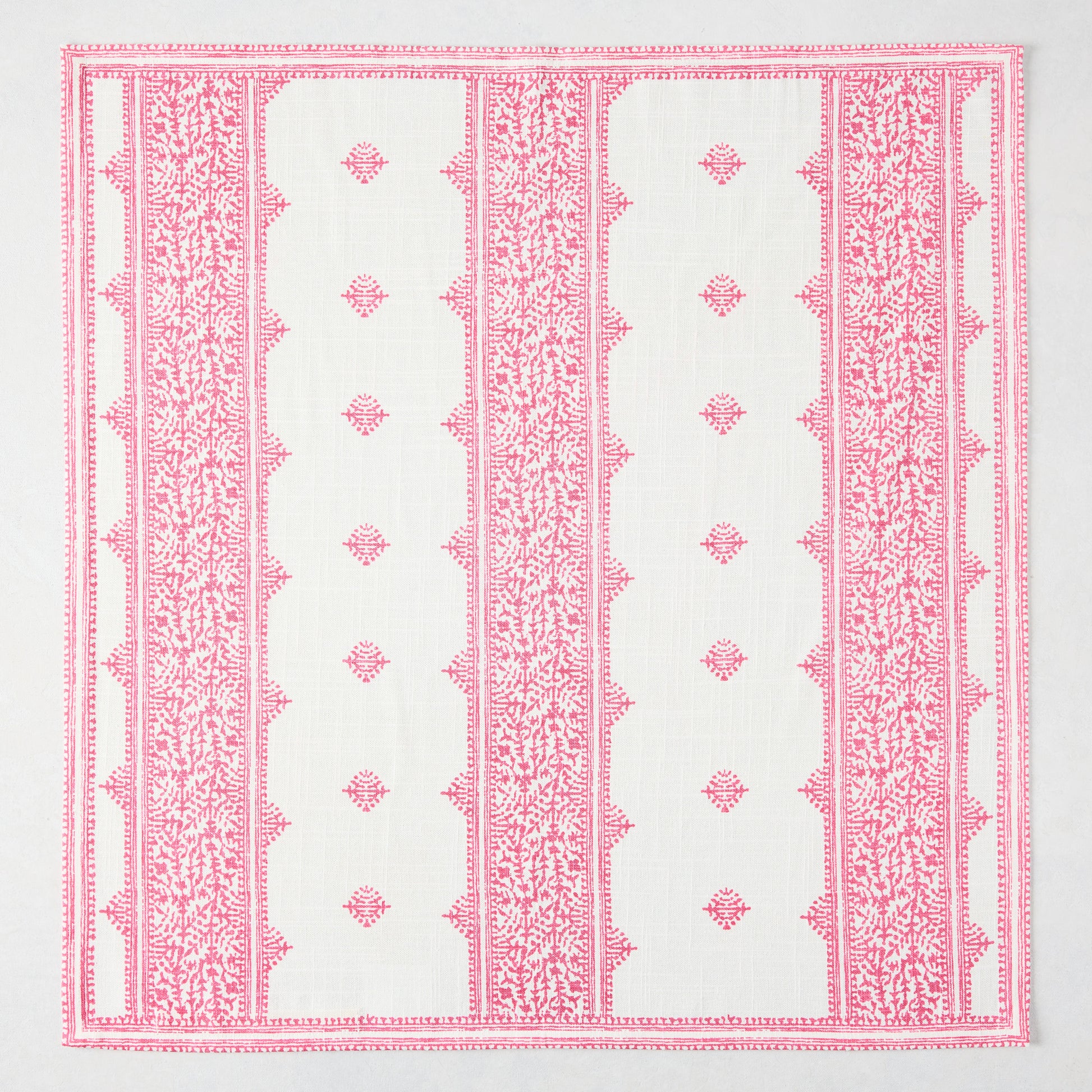 Bright pink Fez Stripe printed cotton slub napkin with intricate vintage embroidery-inspired pattern.