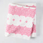 Folded Peter Dunham + Hudson Grace Bright Pink Fez Stripe cotton slub tablecloth with intricate pattern.