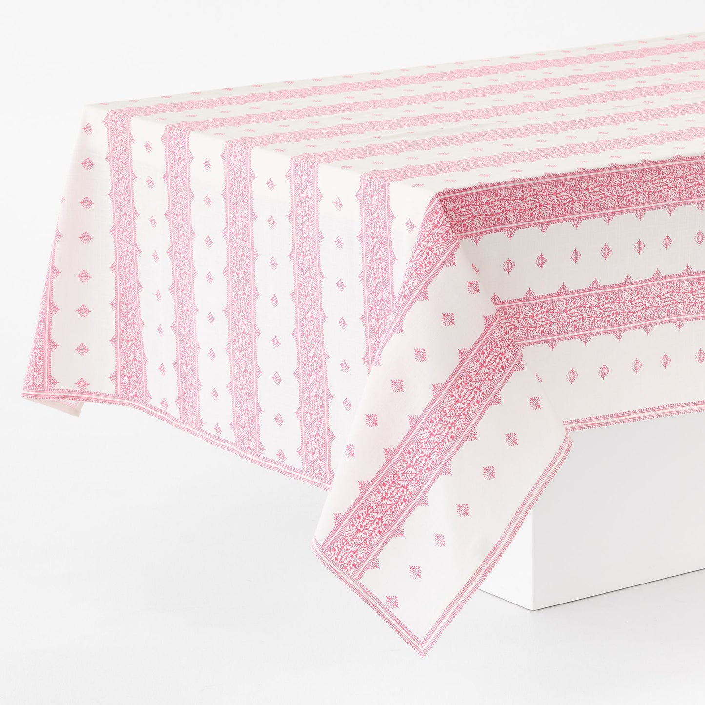 Rectangular 108x70 inch cotton slub tablecloth with bright pink vintage-inspired Fez stripe print on white background.