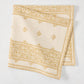 Peter Dunham + Hudson Grace Golden Yellow Fez Stripe printed natural cotton slub napkin, folded.