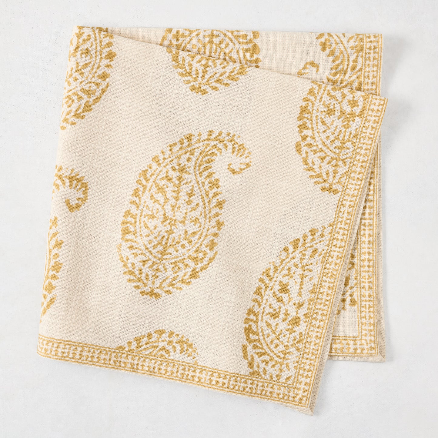 Peter Dunham + Hudson Grace Golden Yellow Kashmir Paisley Printed Napkin, ivory with gold motif.