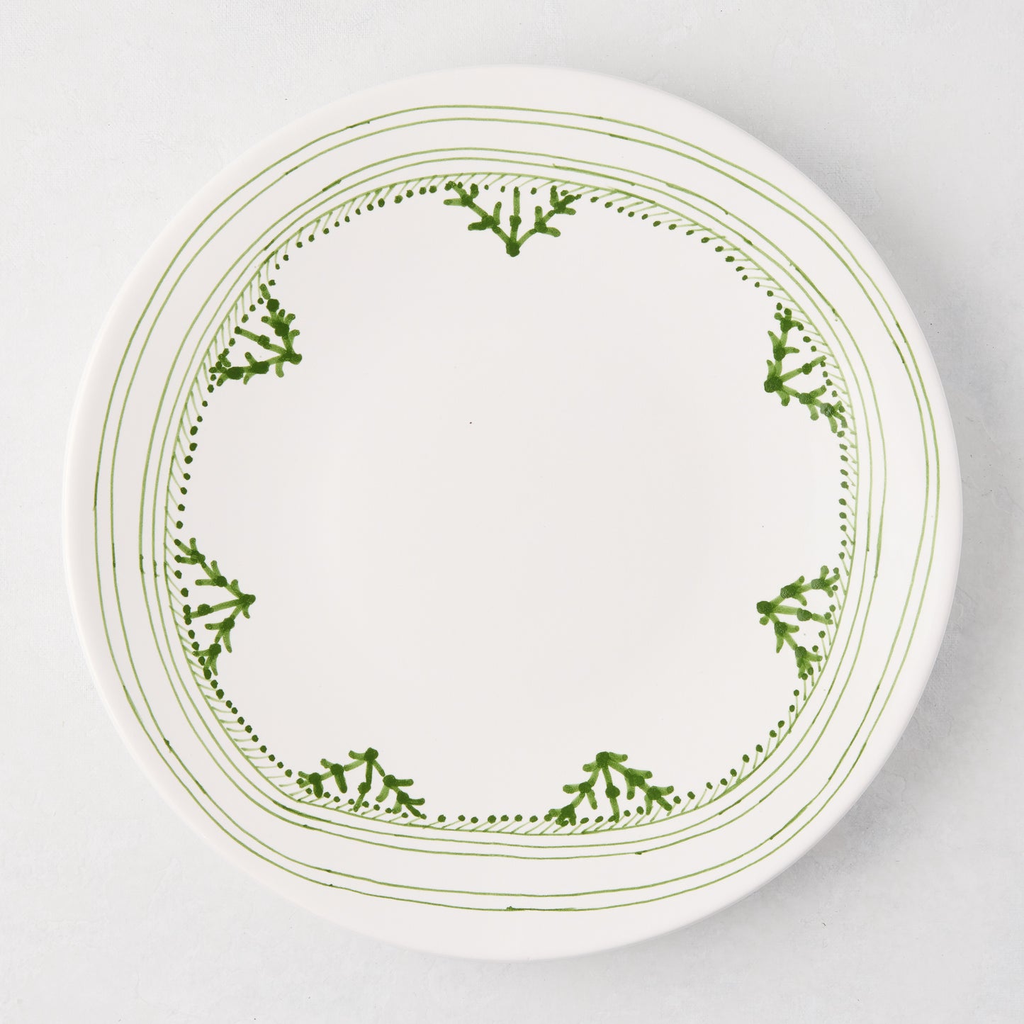 Peter Dunham + Hudson Grace Green Fez hand-painted border dinner plate, white with green pattern.