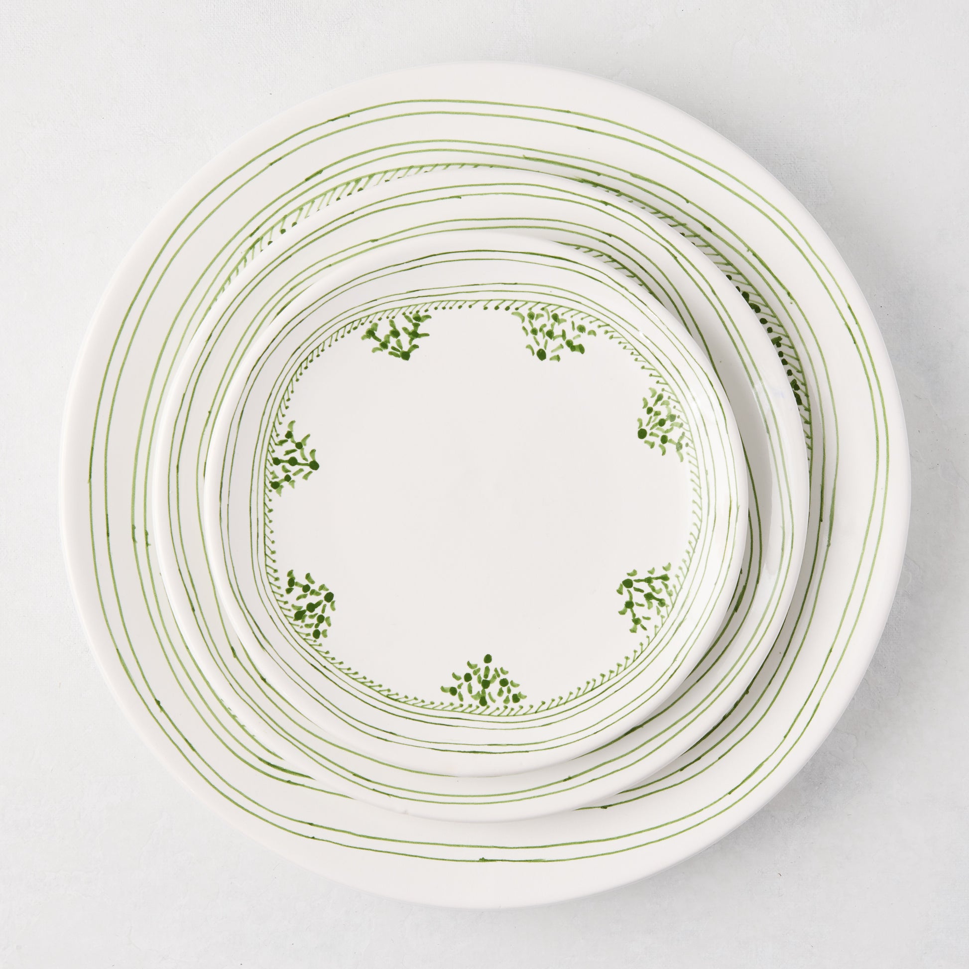 Peter Dunham + Hudson Grace Green Fez hand-painted border salad plate, white ceramic with green stripe and leaf pattern.
