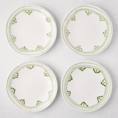 Four white Peter Dunham + Hudson Grace Green Fez hand-painted border salad plates with green patterns.