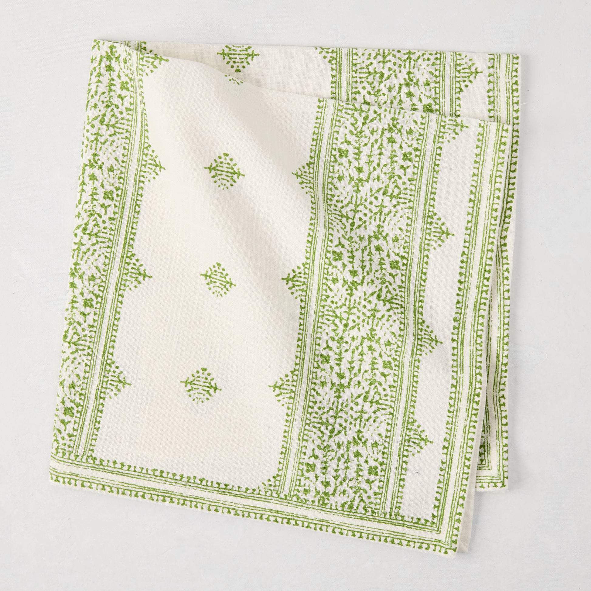 Peter Dunham + Hudson Grace Green Fez Stripe printed cotton slub napkin, folded.
