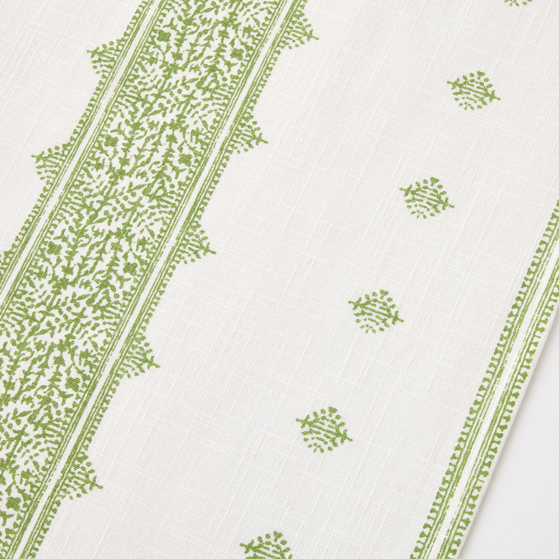 Peter Dunham + Hudson Grace green Fez stripe cotton table runner with intricate vintage-inspired embroidery pattern.