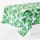 Peter Dunham cotton slub tablecloth with green fig leaf print on pale blue background, 108x70 inches.