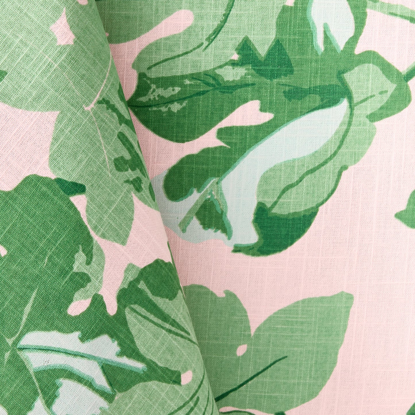 Peter Dunham + Hudson Grace pink cotton slub tablecloth with green fig leaf print.