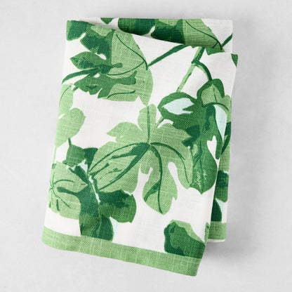 Peter Dunham + Hudson Grace Green Fig Leaf Printed White Tablecloth, 100% cotton slub, folded.