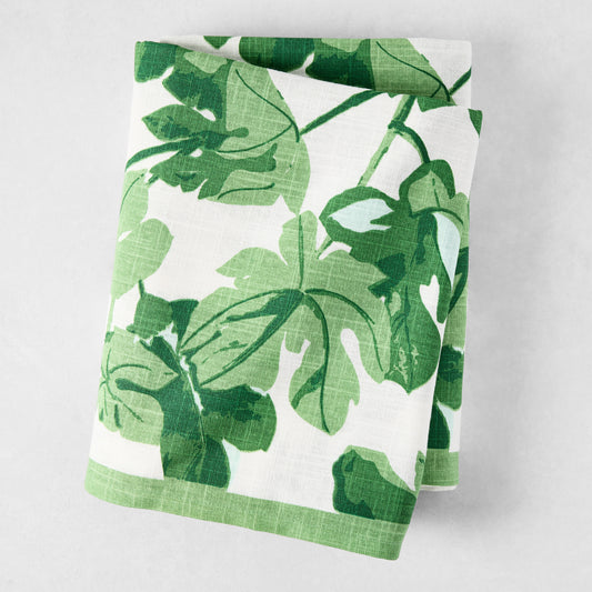 Peter Dunham + Hudson Grace Green Fig Leaf Printed White Tablecloth, 100% cotton slub, folded.