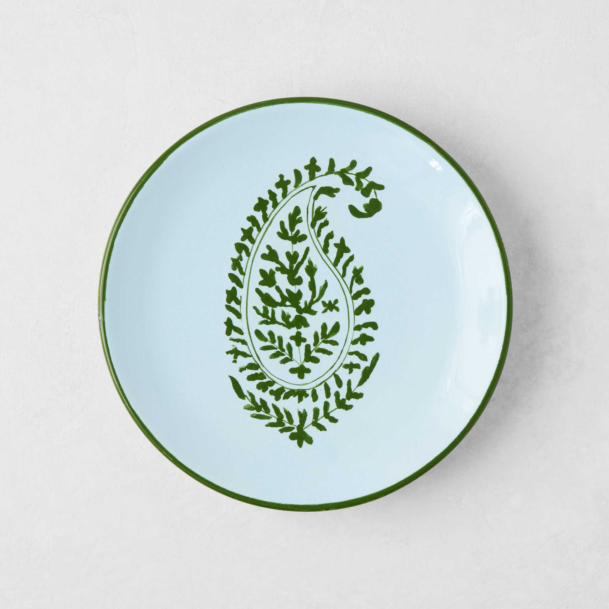 Peter Dunham + Hudson Grace green hand-painted Kashmir paisley appetizer plate, light blue with green rim.