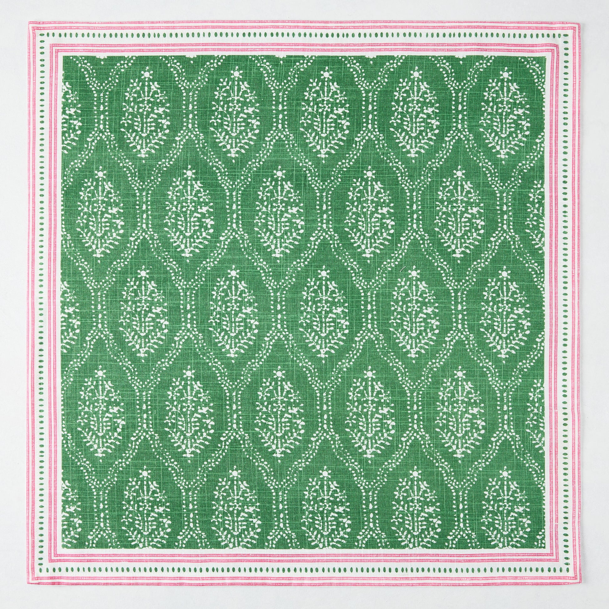 Peter Dunham + Hudson Grace Green Jaali printed cotton slub napkin with pink border.